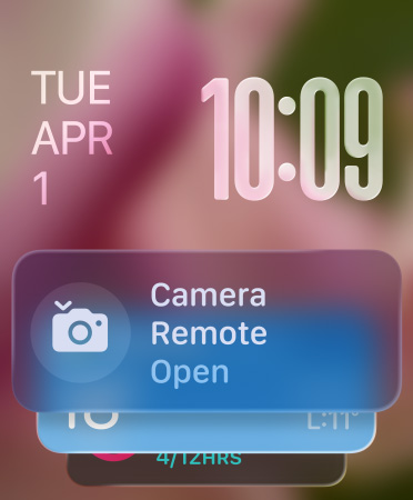 Remote Camera widget appears at the bottom of a screen, translucent time numerals at top right, date at top left