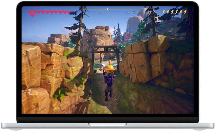 MacBook Neo, silver color, screen shows a scene from the game Oceanhorn 3