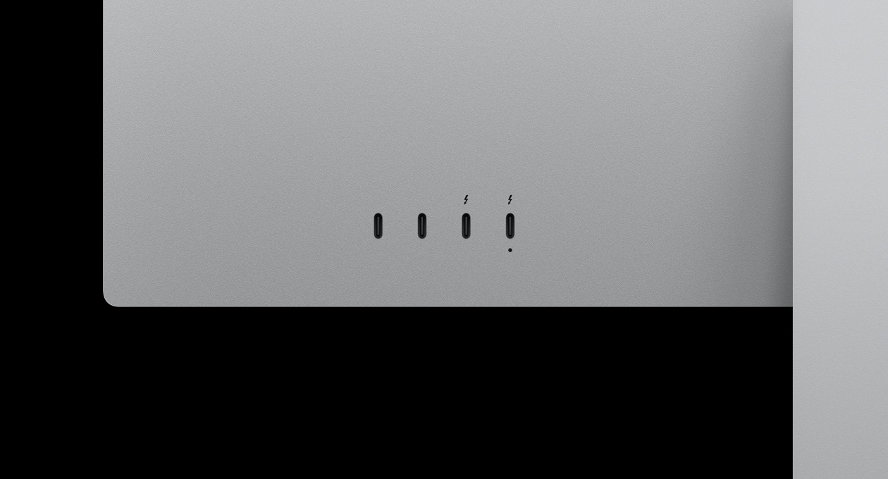 Close-up on rear of Studio Display XDR, highlighting two USB-C ports and two Thunderbolt 5 ports