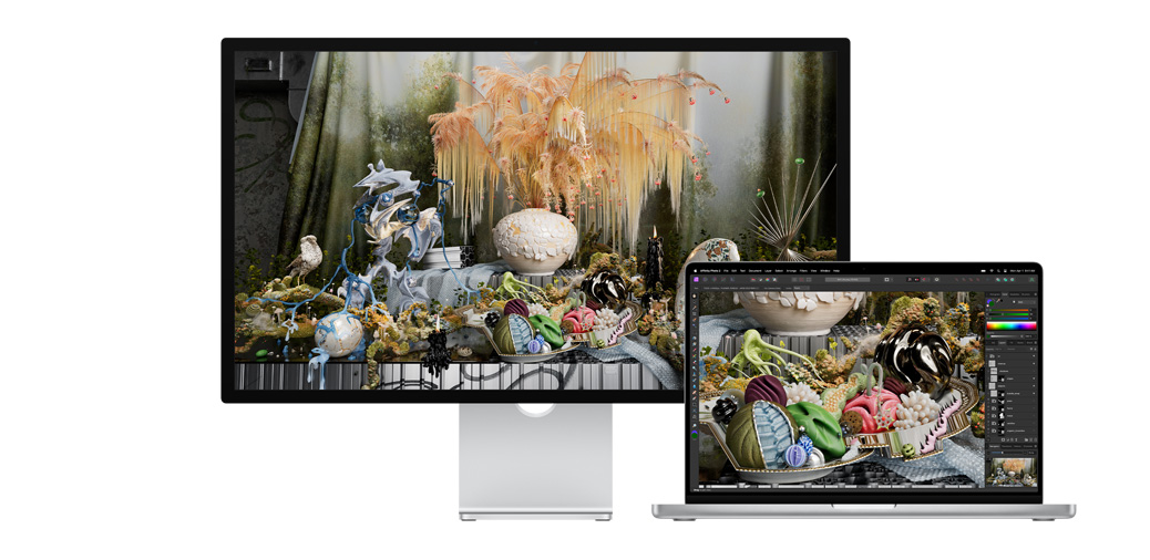 14-inch MacBook Pro alongside Studio Display showing a project in Affinity Photo.